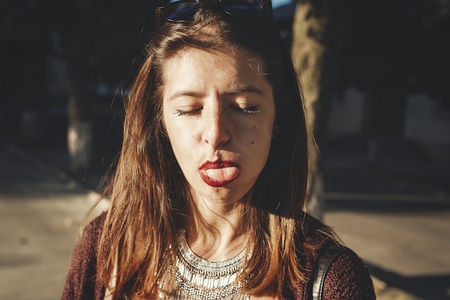 girl showing her tongue