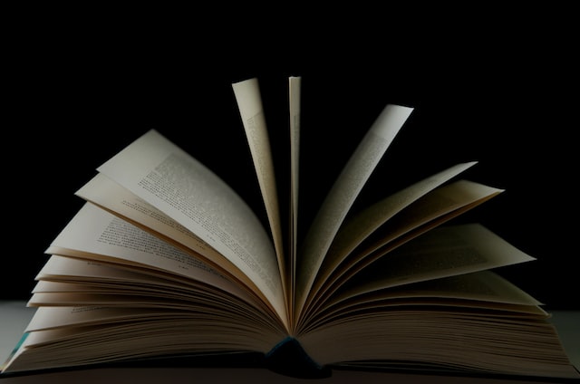 magic book, black background, paper