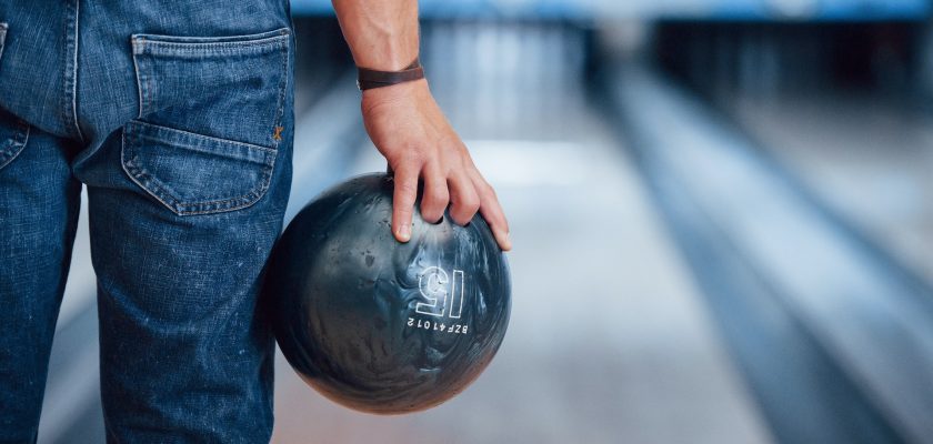 man holding a bowling ball