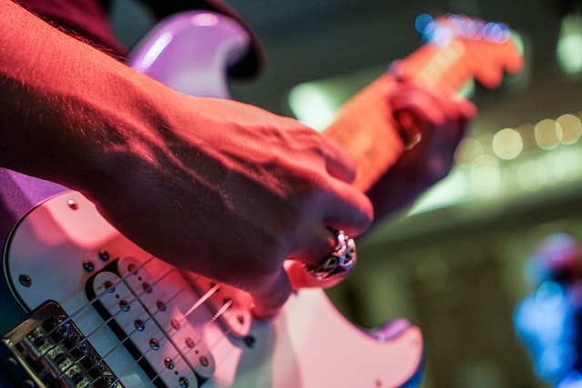 man holding an electric guitar