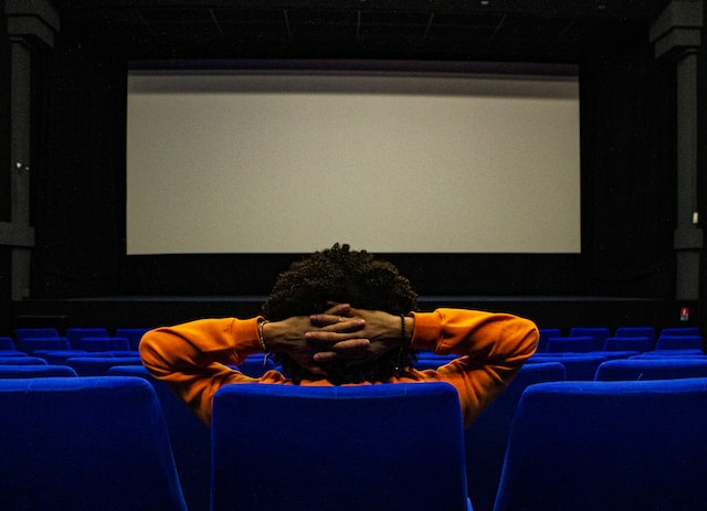 one person is sitting in the cinema